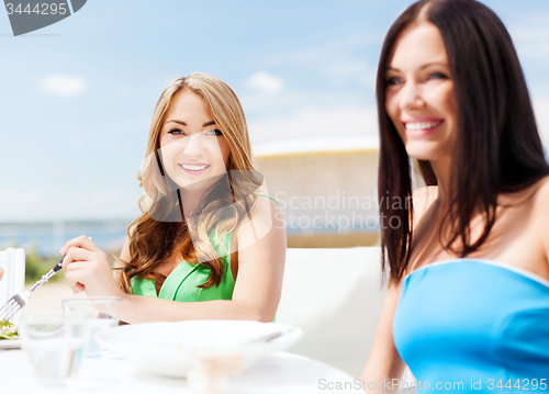 Image of girls in cafe on the beach