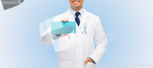 Image of happy doctor with prostate cancer awareness ribbon