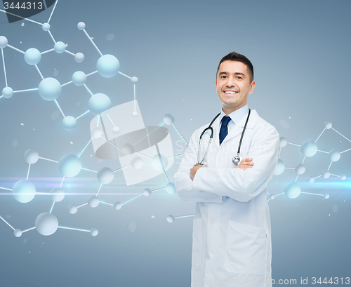 Image of smiling male doctor over molecule formula