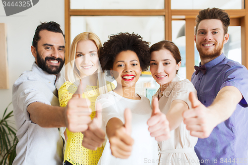 Image of happy creative team in office