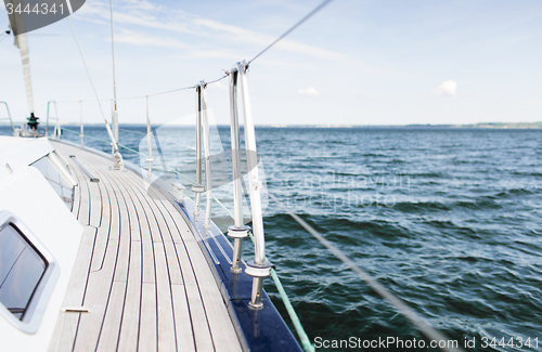 Image of close up of sailboat or sailing yacht deck and sea