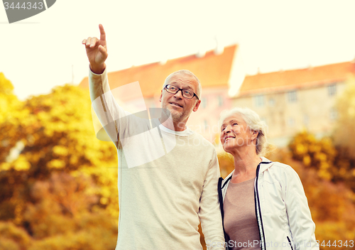 Image of senior couple in city park