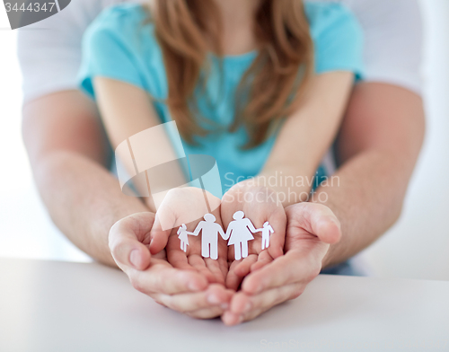 Image of close up of man and girl with cupped hands at home