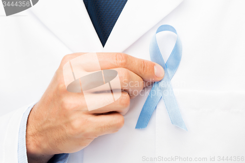 Image of doctor hand with prostate cancer awareness ribbon