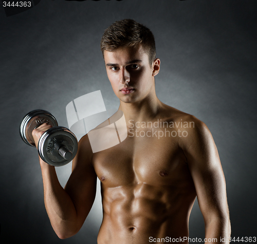 Image of young man with dumbbell