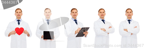 Image of doctors with red heart, tablet pc and clipboard