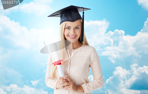 Image of happy student girl in bachelor cap with diploma