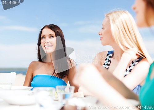 Image of girls in cafe on the beach