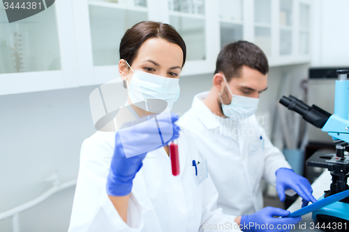 Image of young scientists making test or research in lab