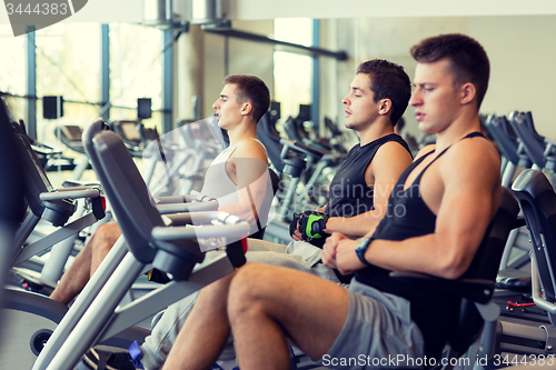 Image of men working out on exercise bike in gym