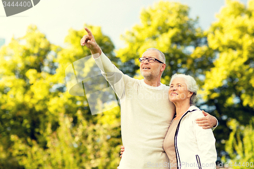 Image of senior couple hugging in park