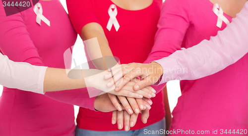 Image of close up of women with cancer awareness ribbons