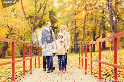 Image of happy family in autumn park