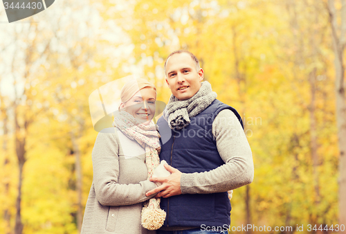 Image of smiling couple in autumn park