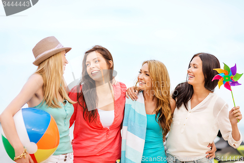 Image of girls with ball on the beach