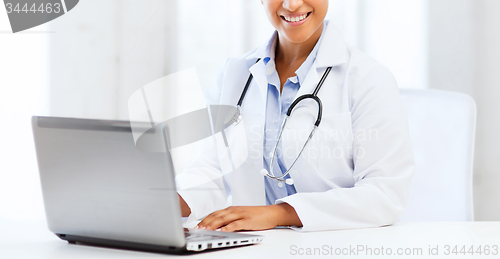 Image of female doctor with laptop pc