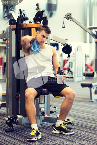 Image of man exercising on gym machine