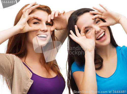 Image of two young teenagers making faces