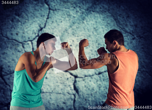 Image of young men fighting hand-to-hand