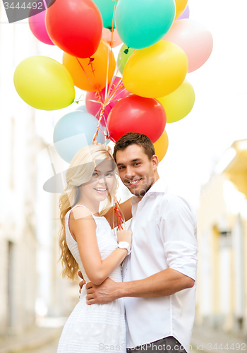 Image of couple with colorful balloons