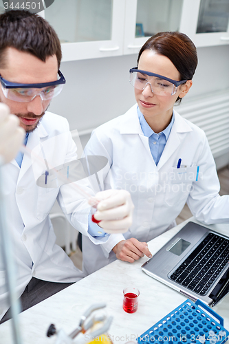 Image of young scientists making test or research in lab