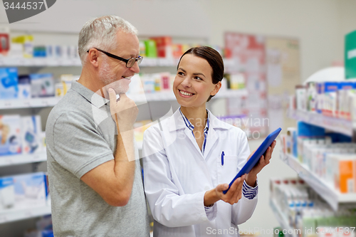 Image of pharmacist with tablet pc and senior man