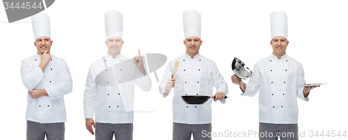 Image of happy male chef with kitchen utensils