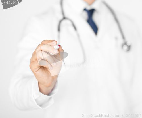 Image of doctor writing something in the air