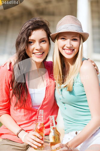 Image of girls with drinks on the beach