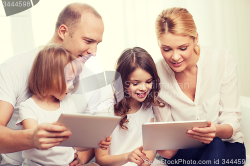 Image of family and two kids with tablet pc computers