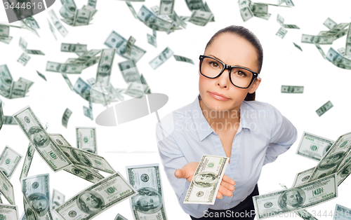 Image of businesswoman with money over blue background