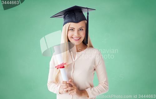 Image of happy student girl in bachelor cap with diploma