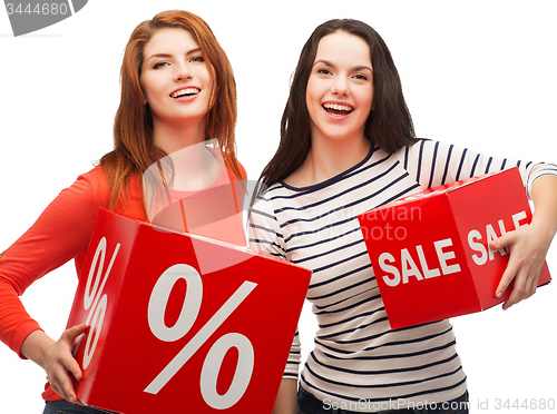 Image of smiling teenage girl with percent and sale sign