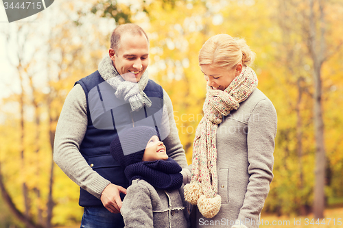 Image of happy family in autumn park