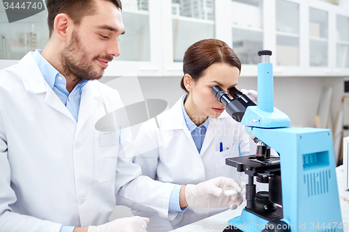 Image of young scientists making test or research in lab