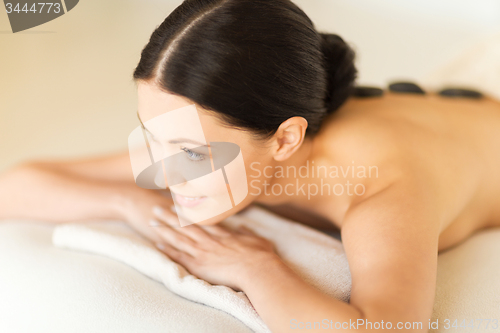 Image of woman in spa with hot stones