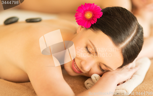 Image of woman in spa with hot stones