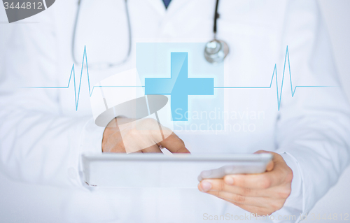 Image of male doctor holding tablet pc with medical app