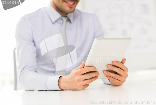 Image of close up of businessman hands with tablet pc