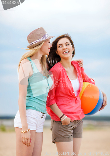 Image of girls playing ball on the beach