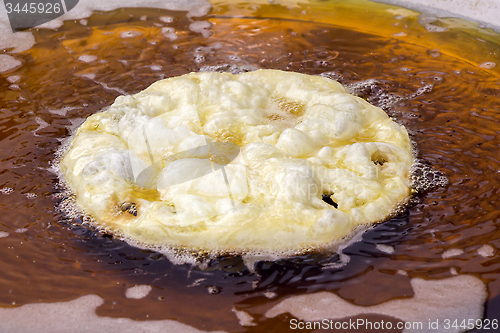 Image of Frying cake dough