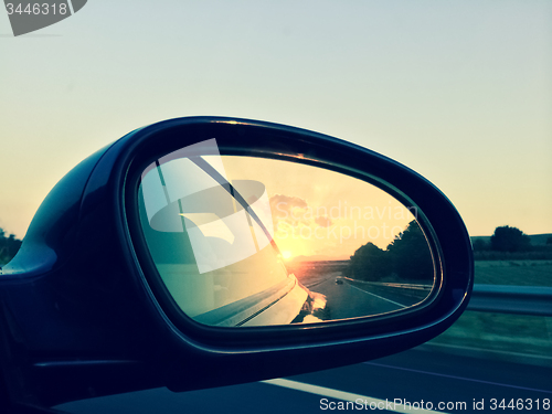 Image of Sunset in a rear view mirror