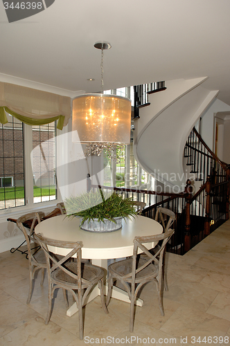 Image of Dining area in a new house whit staircase.