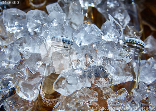 Image of Bottle of beer is in ice