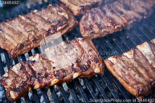 Image of Grilled pork ribs on the grill.