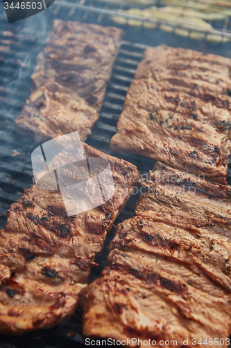 Image of Grilled pork ribs on the grill.