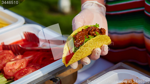 Image of Chef making tacos at a street cafe