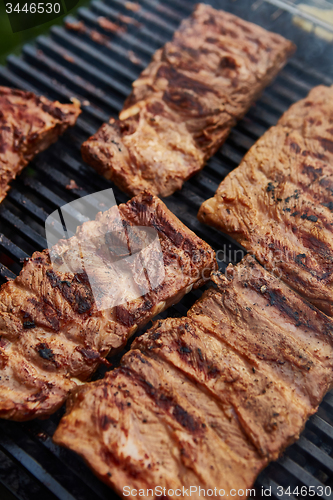 Image of Grilled pork ribs on the grill.