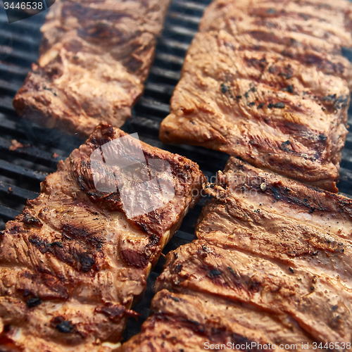 Image of Grilled pork ribs on the grill.