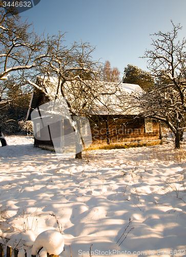 Image of wooden house in the winter.